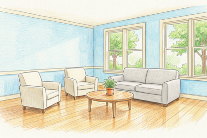 Calm bright youth behavioral health common room with sofa and armchairs